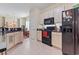 Spacious kitchen with sleek black appliances, ample counter space, and an open view to the dining area at 155 Palmetto Green Dr., Longs, SC 29568