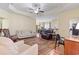 Bright and airy living space with hardwood floors and open layout connecting to the dining area at 155 Palmetto Green Dr., Longs, SC 29568