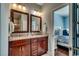 Bathroom featuring double sinks, granite countertops, and wood cabinets at 1733 24Th Ave. N, North Myrtle Beach, SC 29582