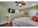 A charming bedroom features a ceiling fan, and a dresser with a wall-mounted television at 1733 24Th Ave. N, North Myrtle Beach, SC 29582