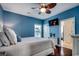 This bedroom features a ceiling fan and a wall-mounted television at 1733 24Th Ave. N, North Myrtle Beach, SC 29582