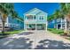 Inviting two-story home with a spacious driveway and lush landscaping, perfect for curb appeal at 1733 24Th Ave. N, North Myrtle Beach, SC 29582
