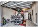 Well-lit garage featuring a golf cart and ample storage space, perfect for hobbies and convenience at 1733 24Th Ave. N, North Myrtle Beach, SC 29582