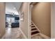 Hallway with staircase leading to a living area featuring backyard access and comfortable furniture at 1733 24Th Ave. N, North Myrtle Beach, SC 29582