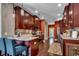 Well-lit kitchen boasts granite countertops, modern appliances, and dark-stained cabinets at 1733 24Th Ave. N, North Myrtle Beach, SC 29582