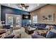 Comfortable living room with a blue accent wall, plush seating, and access to the backyard at 1733 24Th Ave. N, North Myrtle Beach, SC 29582