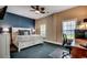 Main bedroom featuring a calming blue accent wall, a large bed, and natural lighting at 1733 24Th Ave. N, North Myrtle Beach, SC 29582