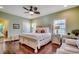 Serene main bedroom features a ceiling fan, hardwood floors, and natural light from the windows at 1733 24Th Ave. N, North Myrtle Beach, SC 29582