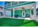 Outdoor patio area with a grill, perfect for entertaining, and a grassy area enclosed by a white fence at 1733 24Th Ave. N, North Myrtle Beach, SC 29582