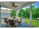 Cozy screened-in porch with a round dining table, perfect for outdoor dining and entertaining at 1733 24Th Ave. N, North Myrtle Beach, SC 29582