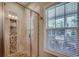Elegant tile shower with glass door next to a window with natural light at 1733 24Th Ave. N, North Myrtle Beach, SC 29582