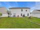 Spacious backyard featuring a patio set, swing, and lush green lawn at 180 Weeping Willow Dr., Myrtle Beach, SC 29579