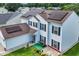 Two-story home with solar panels, well-kept lawn, and inviting front porch at 180 Weeping Willow Dr., Myrtle Beach, SC 29579