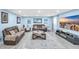 Comfortable living room with light blue walls, recessed lighting, and modern furniture at 180 Weeping Willow Dr., Myrtle Beach, SC 29579