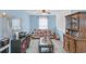 Cozy living room with a decorative couch, natural light, and traditional wood furniture at 180 Weeping Willow Dr., Myrtle Beach, SC 29579