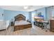 Spacious main bedroom with a large bed, light-colored walls, a TV, and ample natural light at 180 Weeping Willow Dr., Myrtle Beach, SC 29579