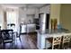 Bright kitchen features modern appliances, granite countertops, and a breakfast bar at 1919 Spring St. # B12, North Myrtle Beach, SC 29582