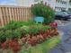Colorful Beach Cottage at O.D. sign surrounded by blooming flowers and manicured landscaping at 1919 Spring St. # B12, North Myrtle Beach, SC 29582
