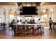 Upscale bar area featuring a large TV, wicker light fixtures, and a view of the ocean at 219 Atlantic Breeze St., Myrtle Beach, SC 29572