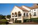 Stunning exterior of a clubhouse with arches, columns, and beautiful landscaping at 219 Atlantic Breeze St., Myrtle Beach, SC 29572
