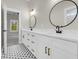 Stylish bathroom with double vanity, modern fixtures, and striking black-and-white mosaic tile floor at 2192 Eastwoods Dr., Conway, SC 29526