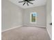 Carpeted bedroom with neutral color scheme and large windows at 2192 Eastwoods Dr., Conway, SC 29526