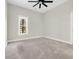 Light-filled bedroom with a ceiling fan and a window overlooking the front yard at 2192 Eastwoods Dr., Conway, SC 29526