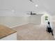 Large bonus room with carpet flooring, neutral walls, natural light, and a view of the pool at 2192 Eastwoods Dr., Conway, SC 29526