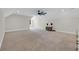 Large bonus room with neutral carpet, a ceiling fan, natural light and ample space for entertaining at 2192 Eastwoods Dr., Conway, SC 29526