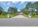 Beautiful two-story home with a long drive, lush lawn, and mature trees at 2192 Eastwoods Dr., Conway, SC 29526