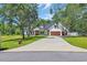 Charming two-story house with an expansive driveway and well-manicured lawn at 2192 Eastwoods Dr., Conway, SC 29526