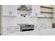 Detailed view of the kitchen with white cabinets, subway tile backsplash, and stainless steel stove at 2192 Eastwoods Dr., Conway, SC 29526