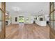 Open-concept layout with hardwood floors connecting the living room and kitchen spaces at 2192 Eastwoods Dr., Conway, SC 29526