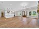 Open floorplan with hardwood floors and a view of the kitchen from the living area at 2192 Eastwoods Dr., Conway, SC 29526