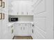 A bright walk-in pantry with floor-to-ceiling white cabinets and stone countertops at 2192 Eastwoods Dr., Conway, SC 29526