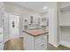 Spacious walk-in closet with an island, custom storage solutions, and bright lighting throughout at 2192 Eastwoods Dr., Conway, SC 29526