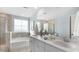 Luxurious bathroom features double sinks, a soaking tub, and a separate glass-enclosed shower at 222 Atlantic Breeze St., Myrtle Beach, SC 29572