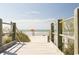 Scenic boardwalk leading to a sandy beach with lifeguard and ocean views at 222 Atlantic Breeze St., Myrtle Beach, SC 29572