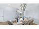 Elegant dining room with stylish chandelier, table setting and stairwell at 222 Atlantic Breeze St., Myrtle Beach, SC 29572