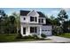Charming two-story home with a welcoming front porch and a well-manicured lawn at 222 Atlantic Breeze St., Myrtle Beach, SC 29572