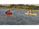 Two people enjoy kayaking on the water, providing a relaxing outdoor activity with serene views of the surroundings at 222 Atlantic Breeze St., Myrtle Beach, SC 29572