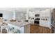 Modern kitchen featuring stainless steel appliances, a spacious island, and sleek white cabinetry at 222 Atlantic Breeze St., Myrtle Beach, SC 29572