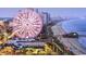 The SkyWheel provides a scenic view from above in this vibrant city waterfront setting, perfect for tourism and entertainment at 222 Atlantic Breeze St., Myrtle Beach, SC 29572