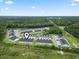 Expansive aerial view of the townhome community surrounded by lush greenery and clear blue skies at 244 Jasper Overlook Way # 244, Myrtle Beach, SC 29588