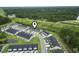 Scenic aerial view of the townhome community with landscaping, pond, and surrounding green space at 244 Jasper Overlook Way # 244, Myrtle Beach, SC 29588