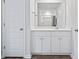 Bright bathroom featuring a vanity with white cabinets, sink, mirror, and view of the shower at 244 Jasper Overlook Way # 244, Myrtle Beach, SC 29588