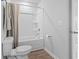 Bathroom with a toilet, a tub and shower combo with a curtain at 244 Jasper Overlook Way # 244, Myrtle Beach, SC 29588