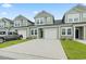 Charming townhome with a one car garage, black front door and muted green siding at 244 Jasper Overlook Way # 244, Myrtle Beach, SC 29588