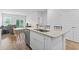 Open concept kitchen island with white cabinets, stainless appliances and dining area at 244 Jasper Overlook Way # 244, Myrtle Beach, SC 29588