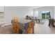 Open living area with a dining table and access to the outdoor space and natural light at 244 Jasper Overlook Way # 244, Myrtle Beach, SC 29588